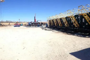Turney Bayou project: a workover rig runs tubing and flow back tanks on the Rosewood Plantation-21H well site