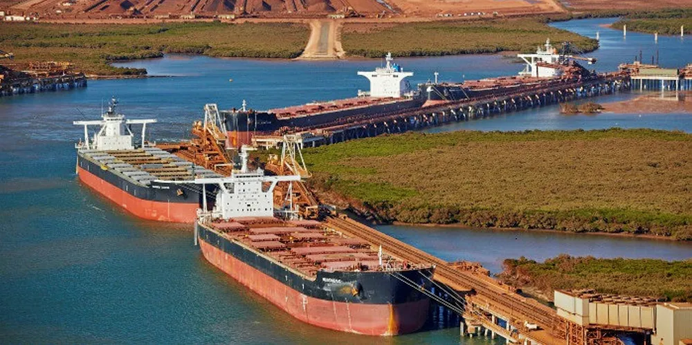 Capesize bulk carriers loading iron ore at Pilbara, Australia.