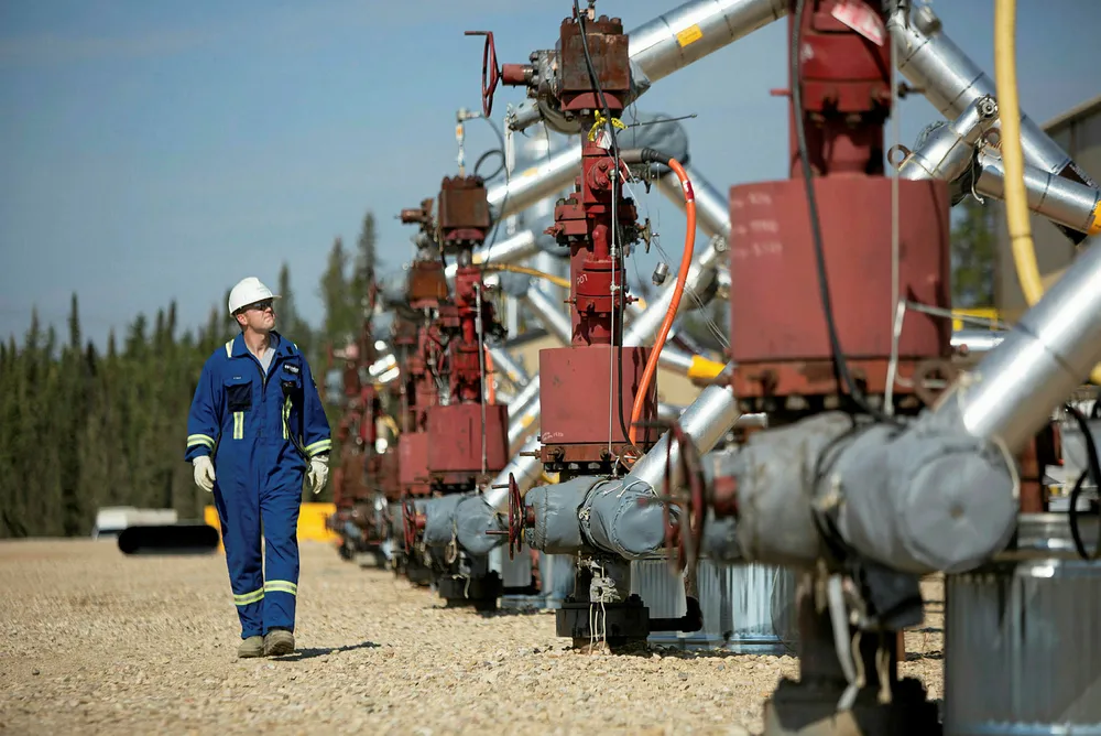 A well pad stands at Cenovus Energy's Christina Lake in situ oil production facility in Conklin, Alberta, Canada, on Thursday, August 15, 2013. Photographer: Brent Lewin/Bloomberg . .