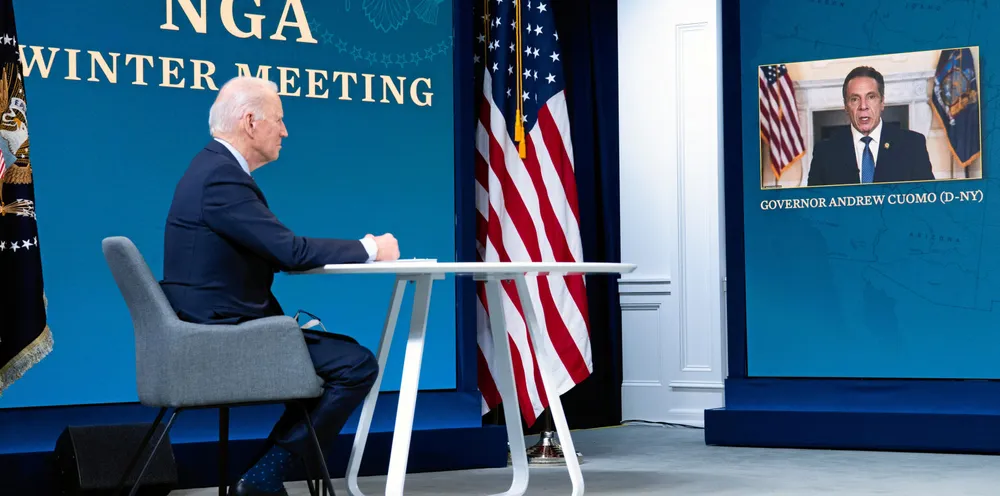 US President Joe Biden speaks with New York Governor Andrew Cuomo (R) during a virtual National Governors Association's Winter Meeting in the Eisenhower Executive Office Building in Washington, DC.