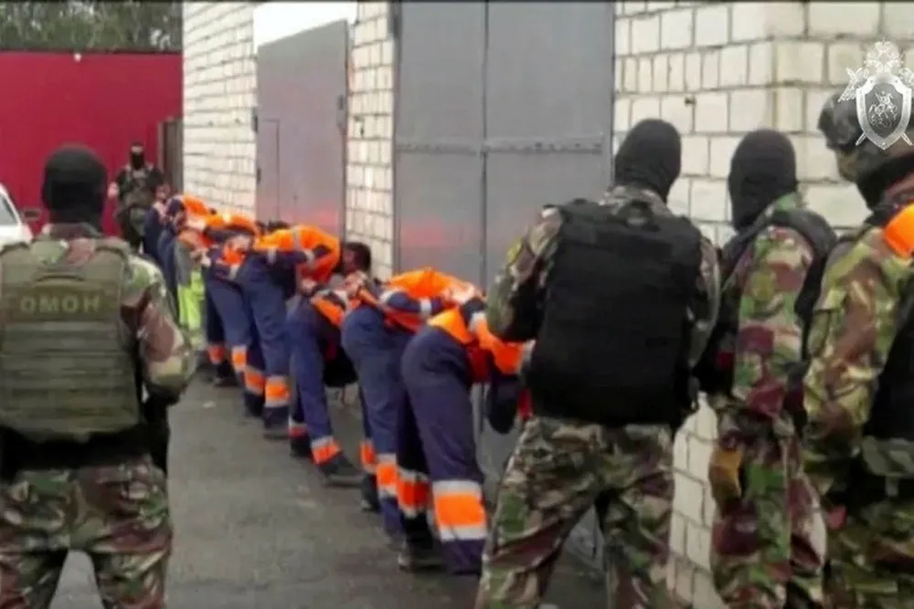 Crackdown: a line of detained protesters at the Amur gas processing plant in Russia