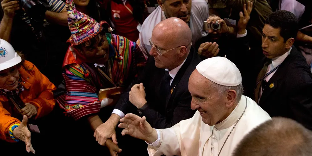 Pope Francis walks among the crowd in Santa Cruz, Bolivia, where he received a standing ovation after denouncing the world’s profligate burning of fossil fuels