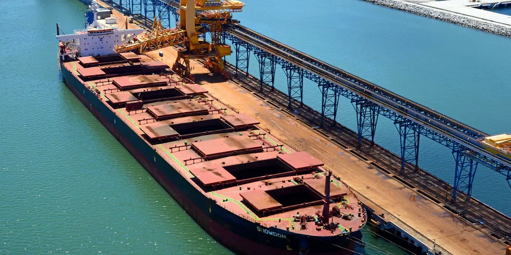 A capesize bulker is being loaded with iron ore at Porto Sudeste, Brazil. Capesize spot rates fell on Wednesday as fears of China cutting back on steel output rippled through the market.