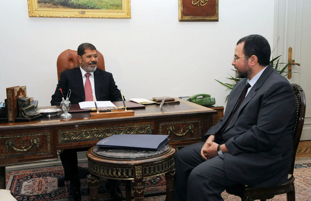 New in charge: Egyptian president Mohamed Mursi, left, and prime minister Hisham Kandil