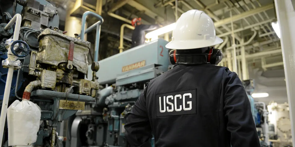 US Coast Guard inspectors check an engine room on a container ship. Evidence of oil dumping can result in criminal cases.