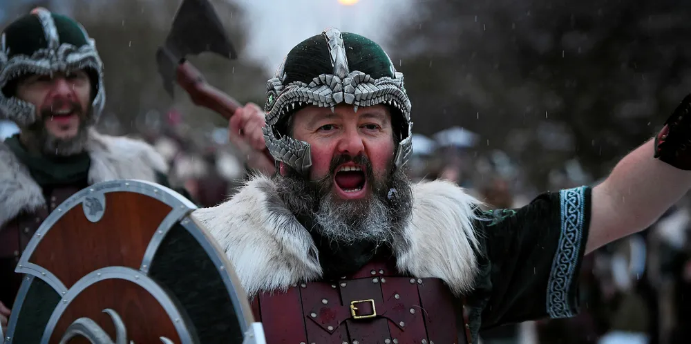 Participants dressed as Vikings parade through the streets of Lerwick, Shetland Islands on January 29, 2019 before the Up Helly Aa festival later in the day.