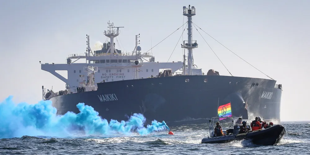 Greenpeace activists in high-speed amphibious rigid inflatable boats place themselves in the path of the TMS Tankers-operated aframax Waikiki, which was on its way from Russia to Rotterdam.
