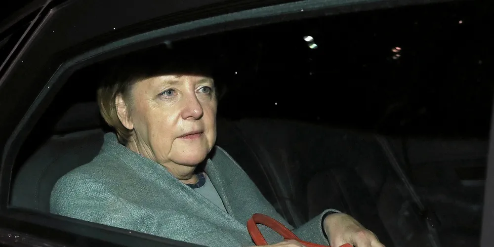 Angela Merkel departs in the early morning after preliminary coalition talks collapsed.