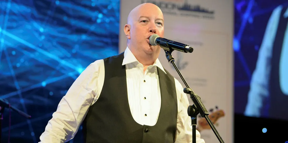 Julian Clark fronting his folk rock band Love Street at the London International Shipping Week dinner
