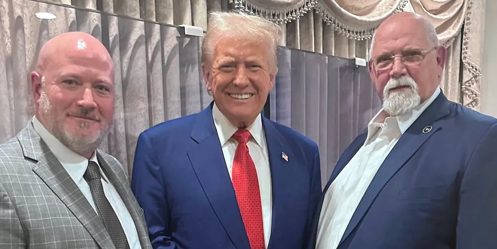 Donald Trump meets ILA executive vice president Dennis Daggett (left) and union president Harold Daggett (right) in December.
