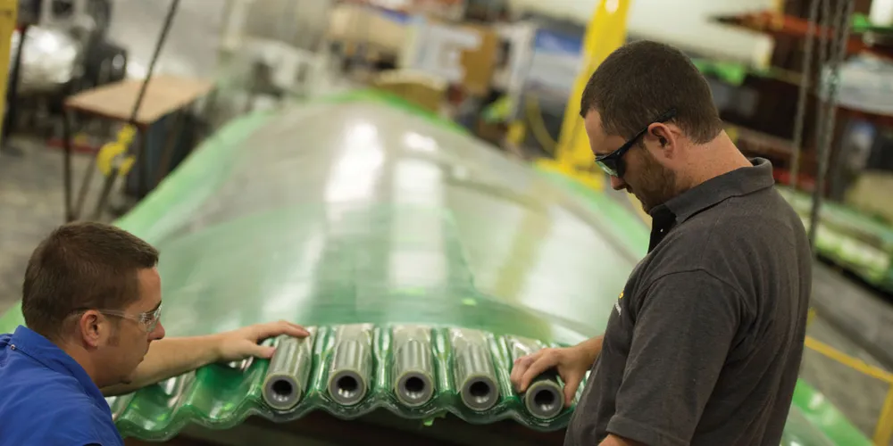 Blade Dynamics engineers prepare root attachments for a 6MW blade