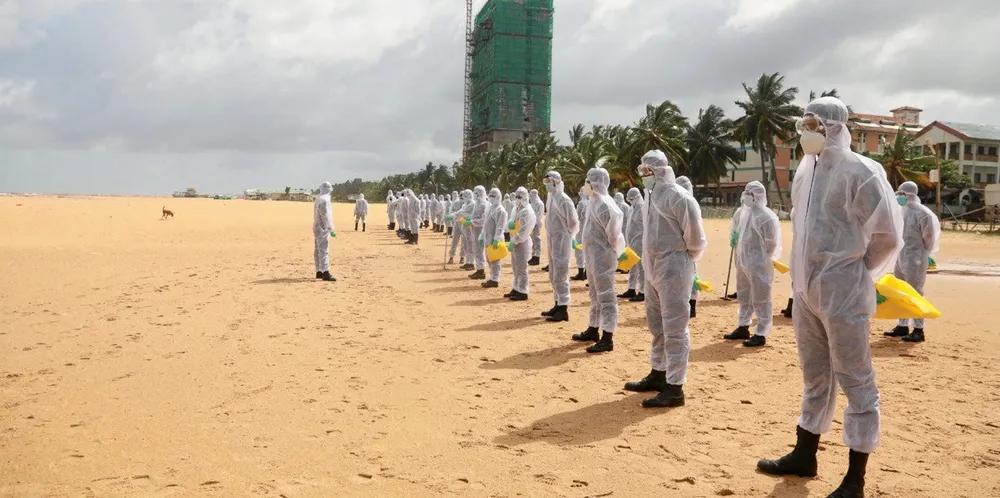 Army troops prepare to clean a beach near Colombo. The sinking of the X-Press Pearl has led to pollution in Sri Lanka.