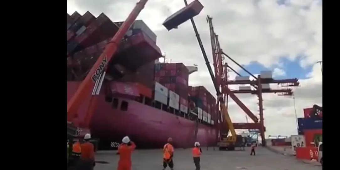 Boxes fall off ONE container ship as heavy winds collapse stacks